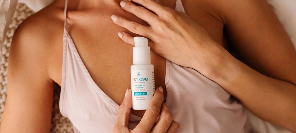 A woman laying on her back with GoLove CBD intimate serum