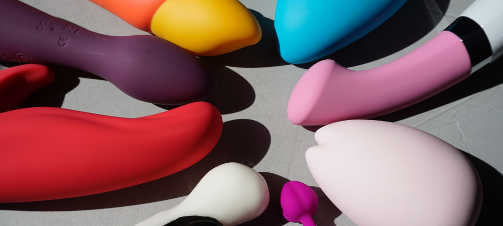 A collection of various multi coloured sex toys 